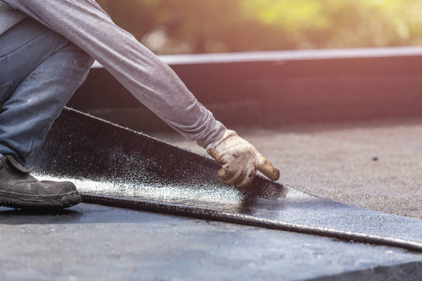 Professional Exterior Waterproofing technician working in Arlington, KS